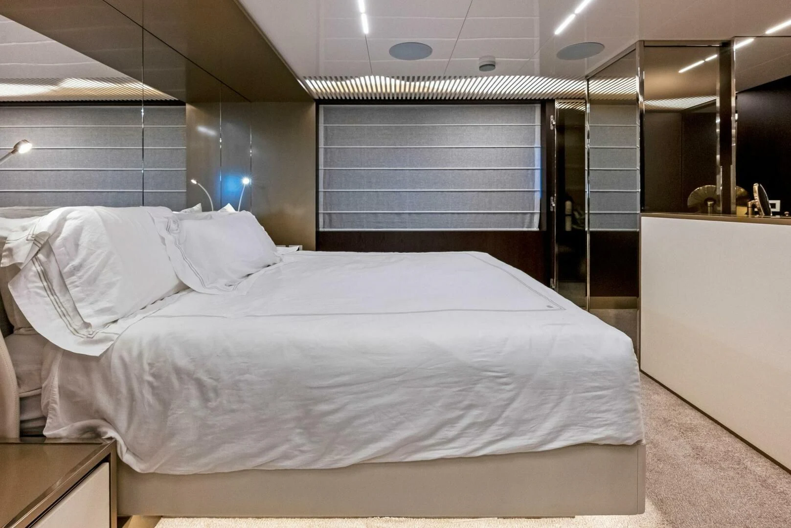 a bed with white sheets aboard INEA Yacht for Sale