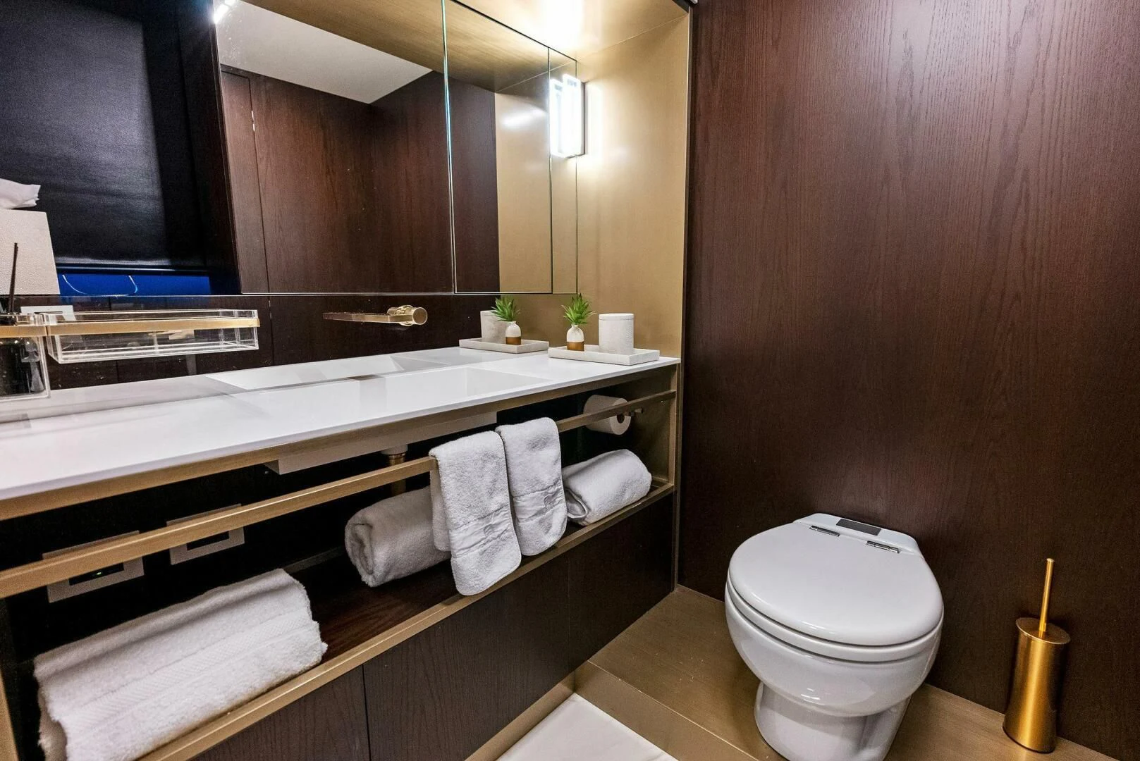 a bathroom with a toilet and a mirror aboard INEA Yacht for Sale