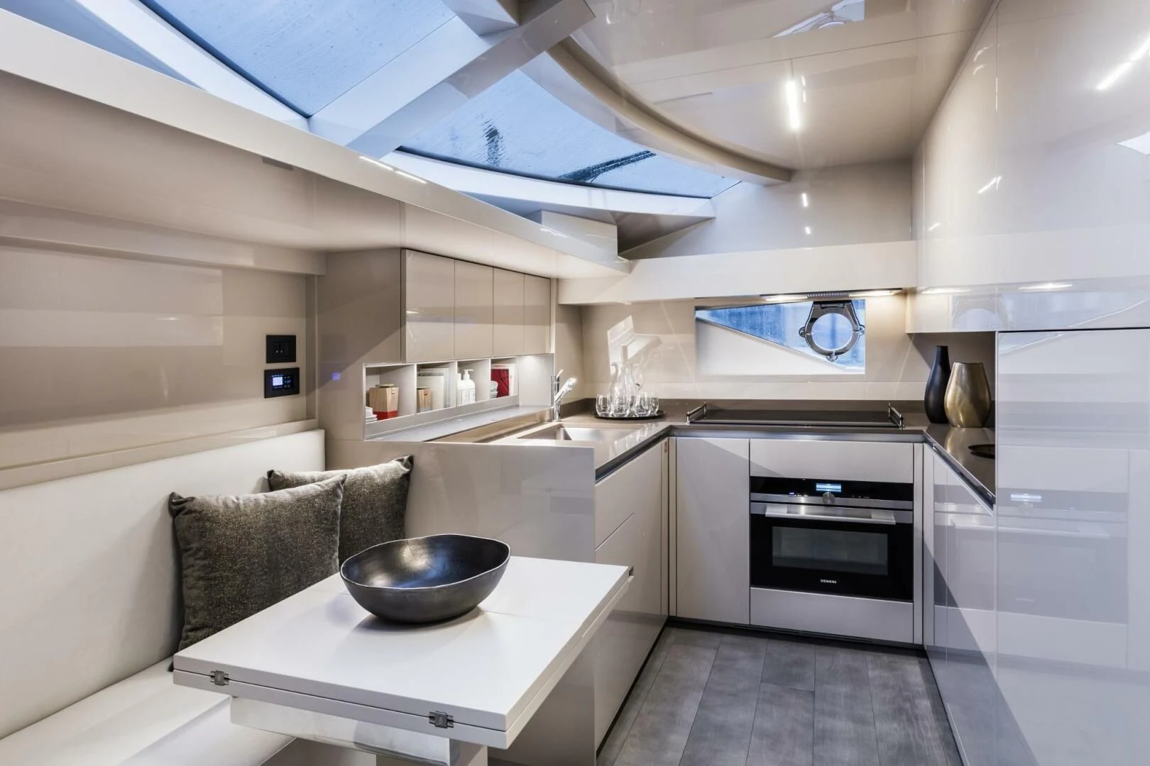 a kitchen with a bowl on a table aboard INEA Yacht for Sale