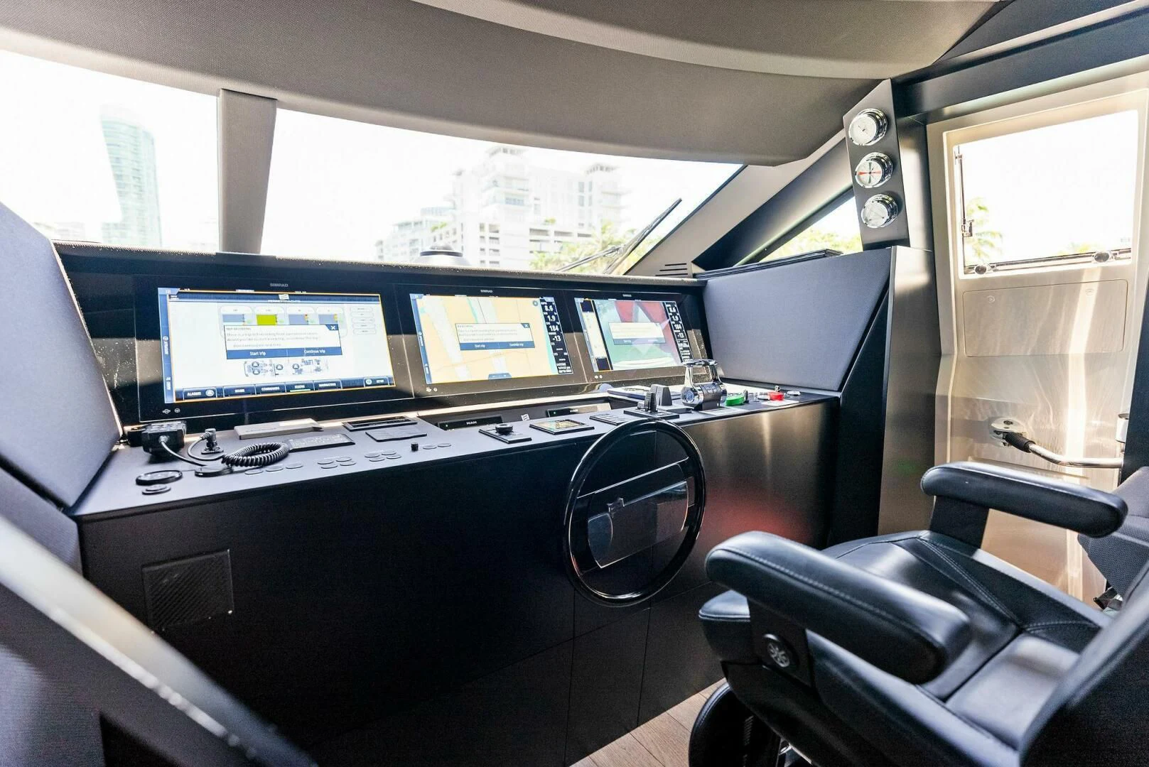 a room with computers and monitors aboard INEA Yacht for Sale