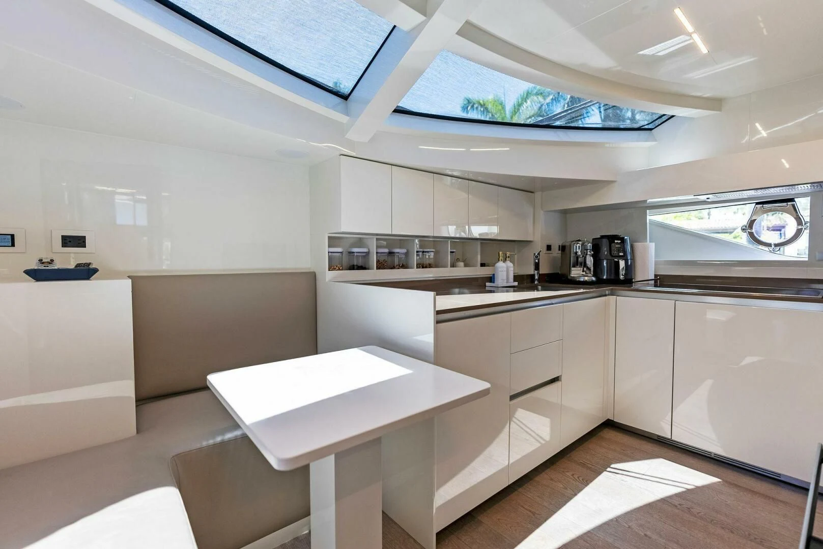 a kitchen with white cabinets aboard INEA Yacht for Sale
