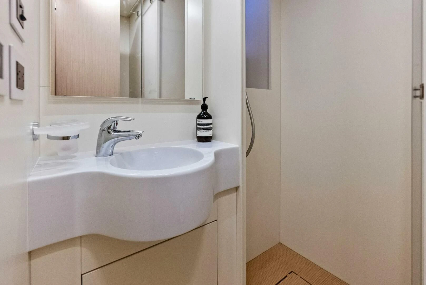 a bathroom with a sink and a mirror aboard INEA Yacht for Sale