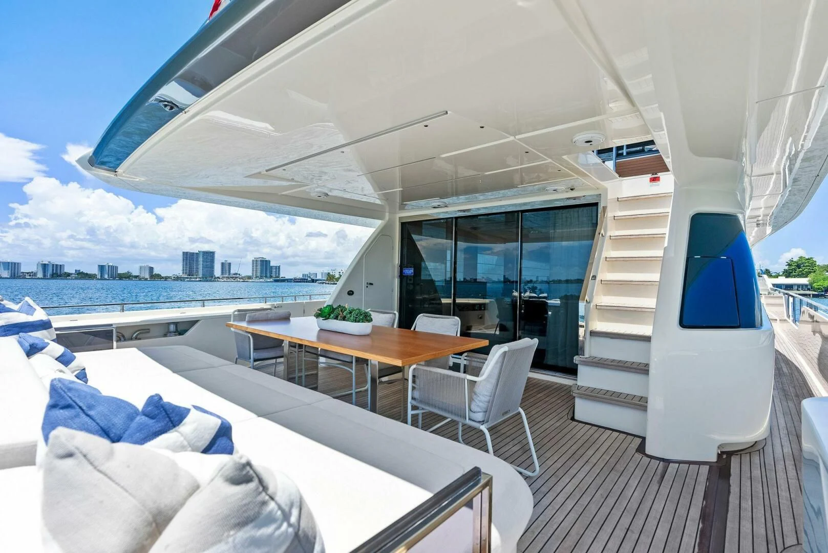 a room with a table and chairs aboard INEA Yacht for Sale