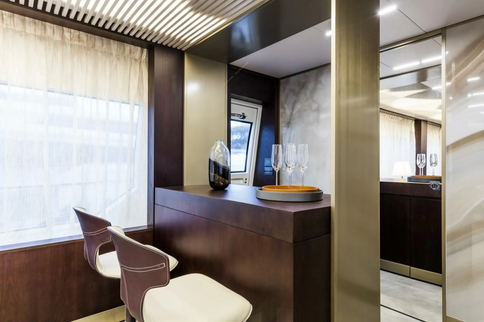 a room with a table and chairs aboard INEA Yacht for Sale