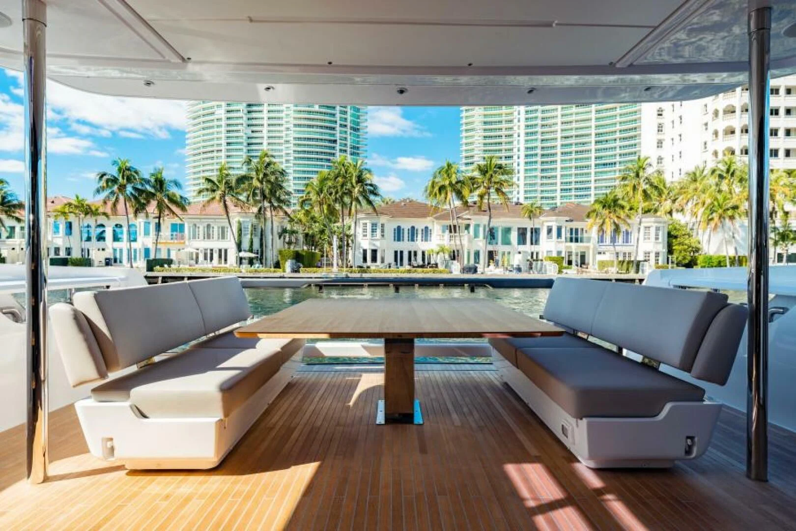 a room with a table and couches aboard INEA Yacht for Sale