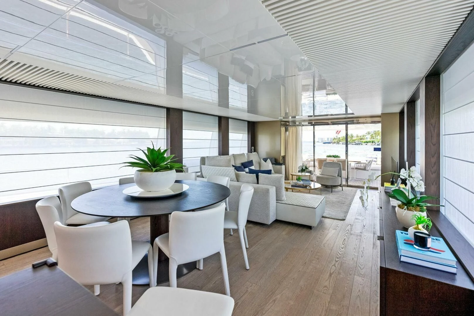 a room with a table and chairs aboard INEA Yacht for Sale