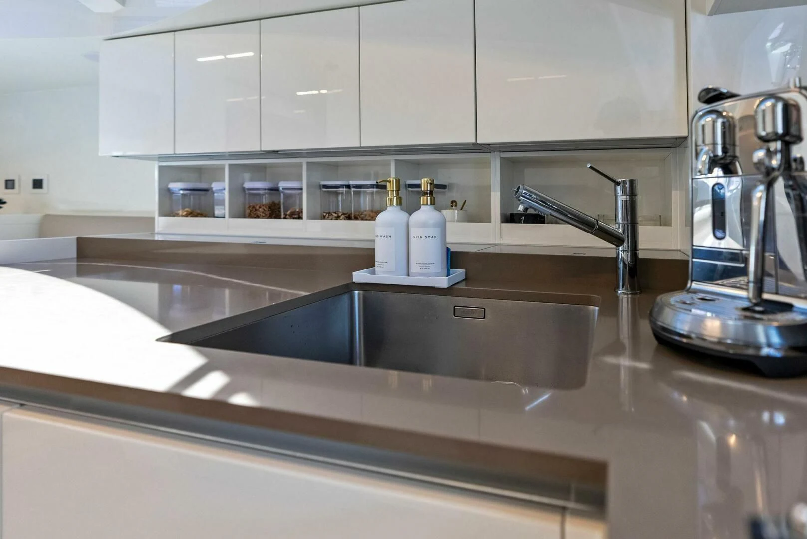 a kitchen counter with a sink and faucet aboard INEA Yacht for Sale