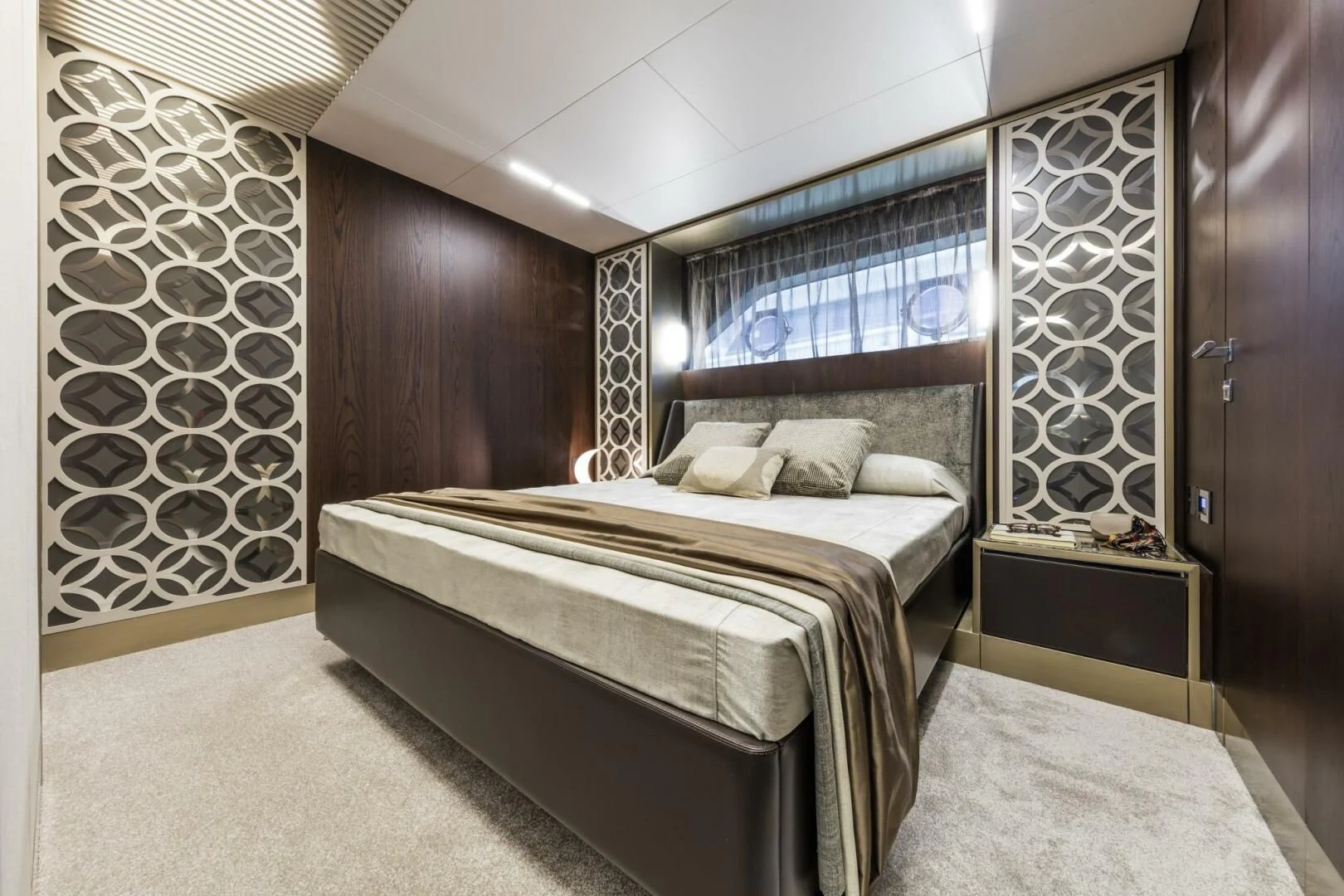 a room with a bed and a mirror aboard INEA Yacht for Sale