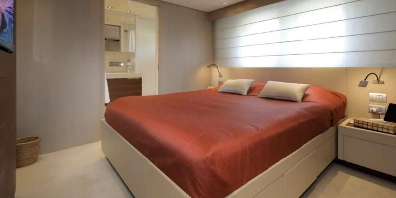 a bed in a room aboard COBANA Yacht for Sale