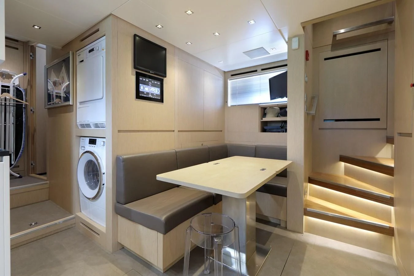 a room with a table and chairs aboard COBANA Yacht for Sale