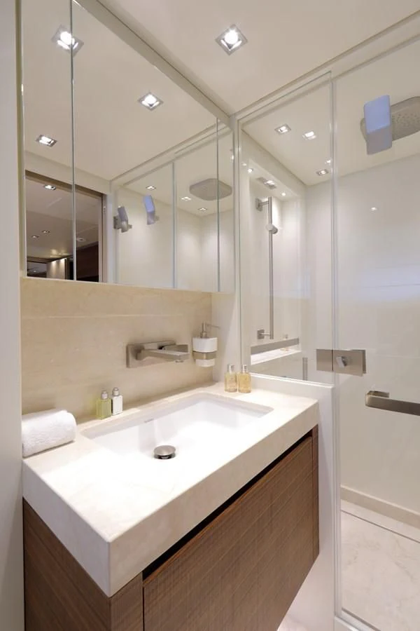 a bathroom with a large mirror aboard COBANA Yacht for Sale