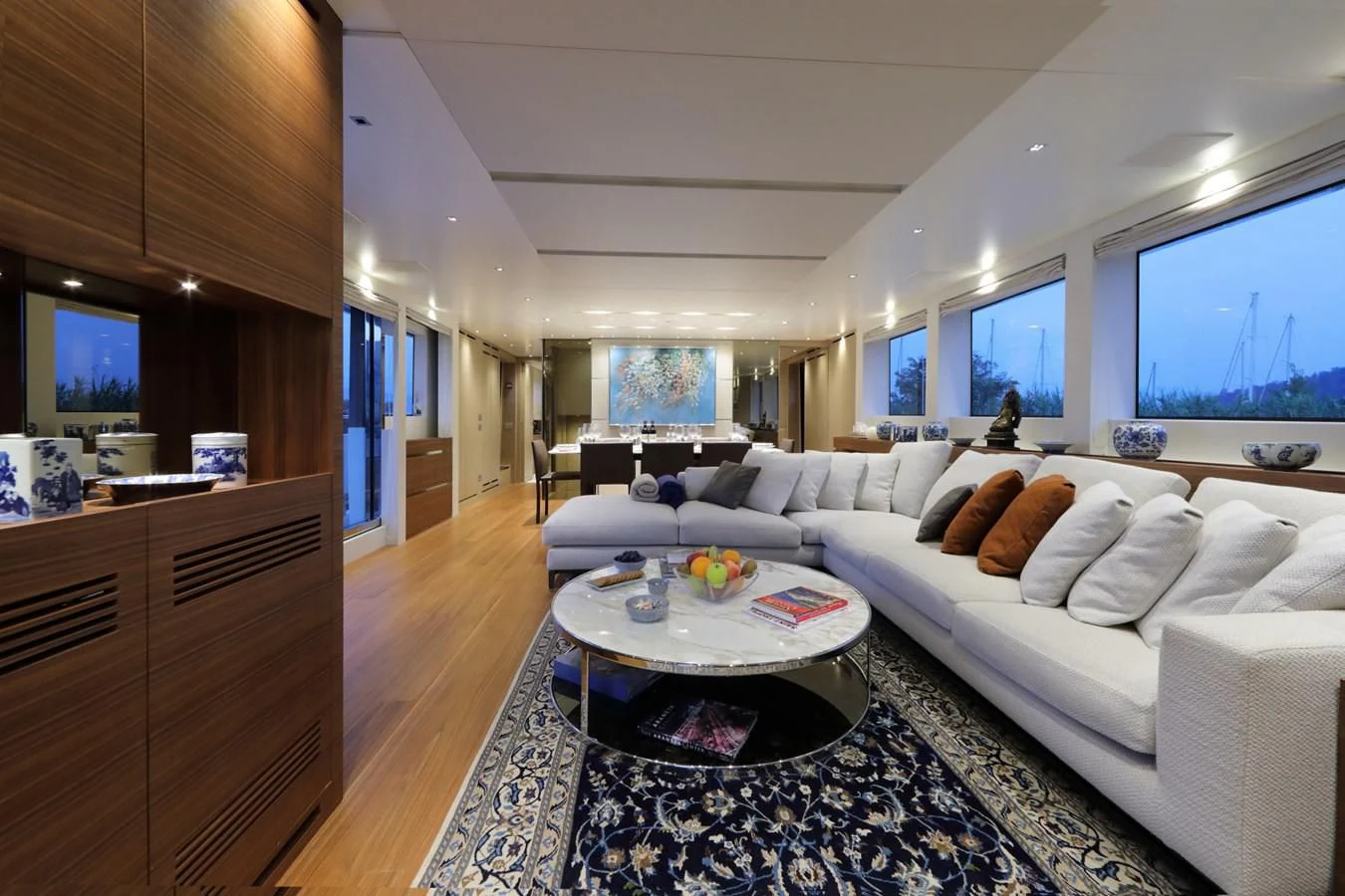a living room with a white couch and a table aboard COBANA Yacht for Sale