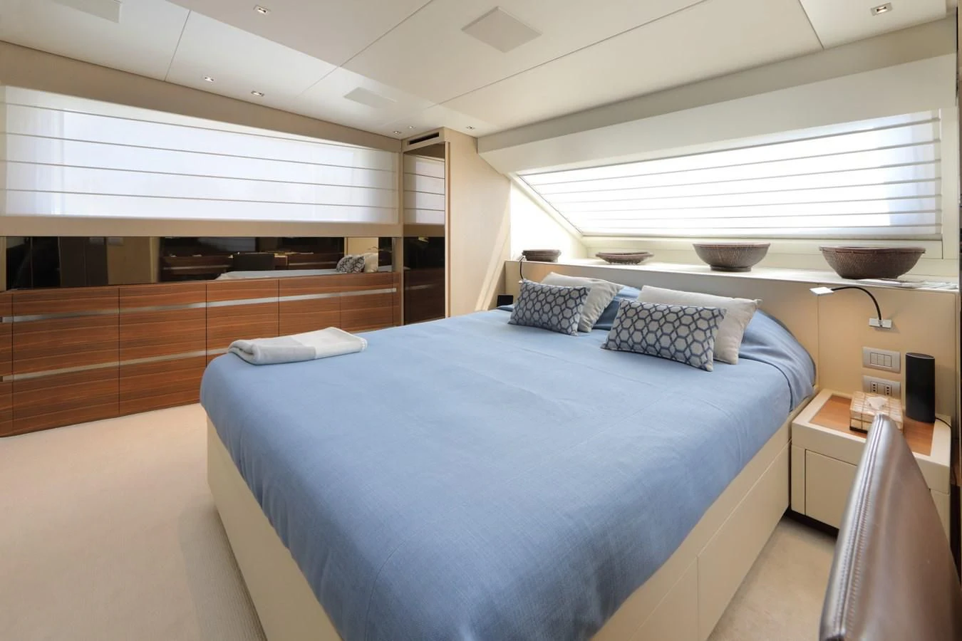 a bedroom with a large bed aboard COBANA Yacht for Sale