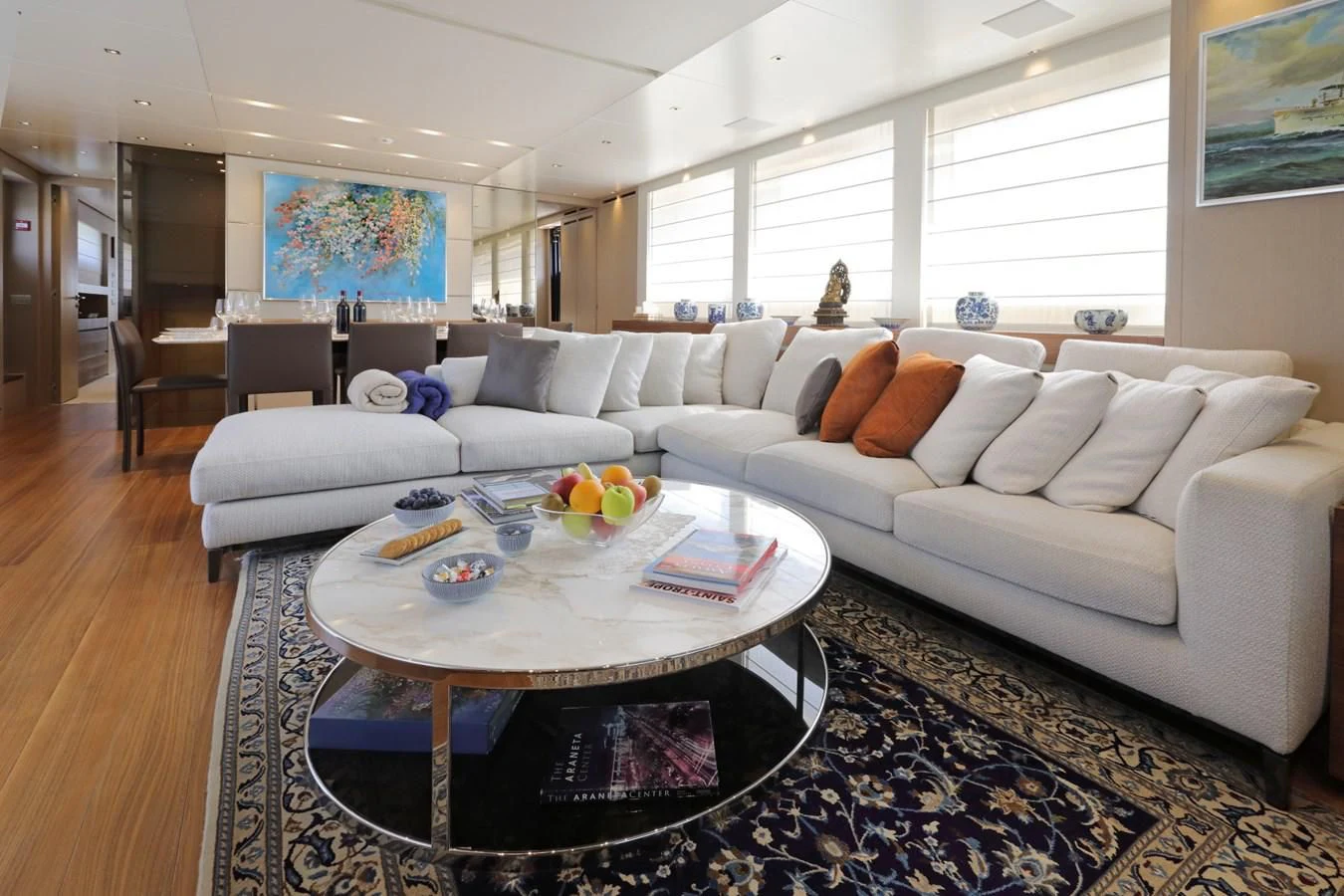 a living room with a couch and a coffee table aboard COBANA Yacht for Sale