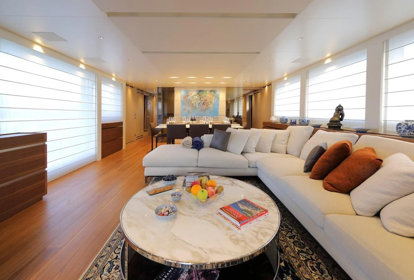 a living room with a couch and a table aboard COBANA Yacht for Sale