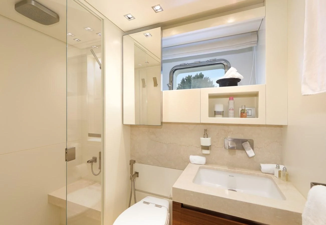 a bathroom with a glass shower aboard COBANA Yacht for Sale
