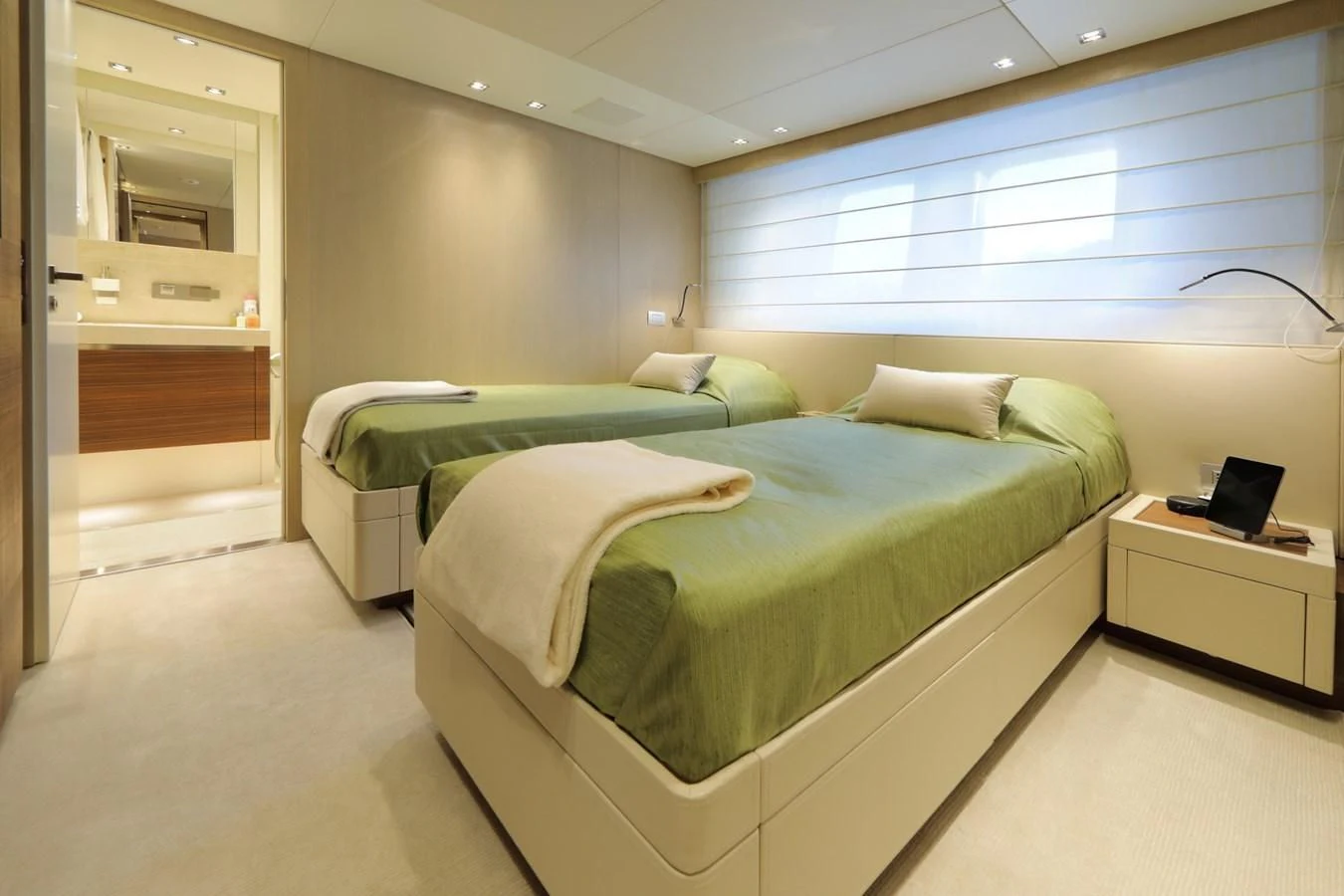 a room with a bed and a desk aboard COBANA Yacht for Sale