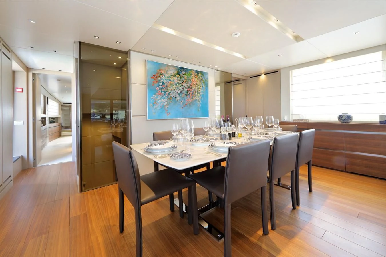 a dining table in a room aboard COBANA Yacht for Sale