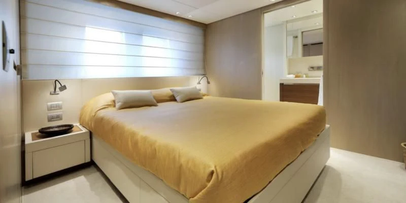 a bed in a room aboard COBANA Yacht for Sale