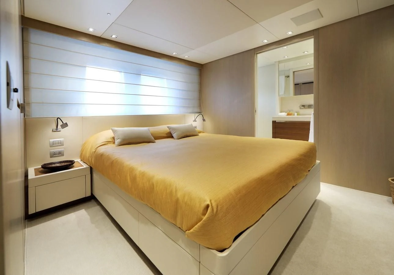 a bed in a room aboard COBANA Yacht for Sale