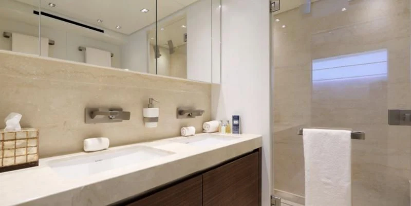 a bathroom with a large mirror aboard COBANA Yacht for Sale