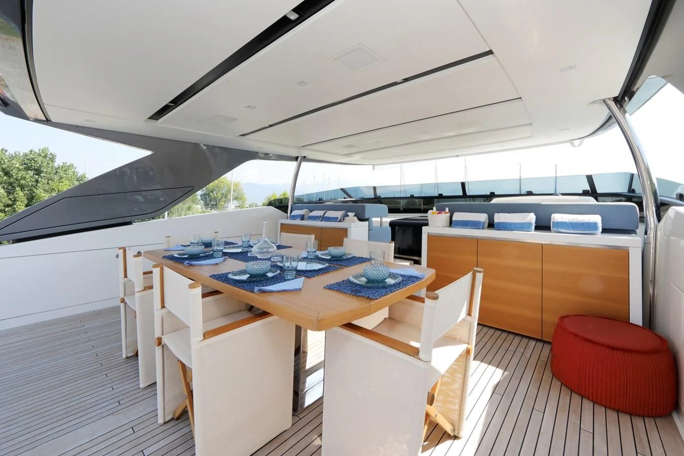 a table with chairs and a laptop on it aboard COBANA Yacht for Sale