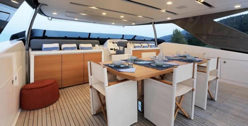 a room with a table and chairs aboard COBANA Yacht for Sale