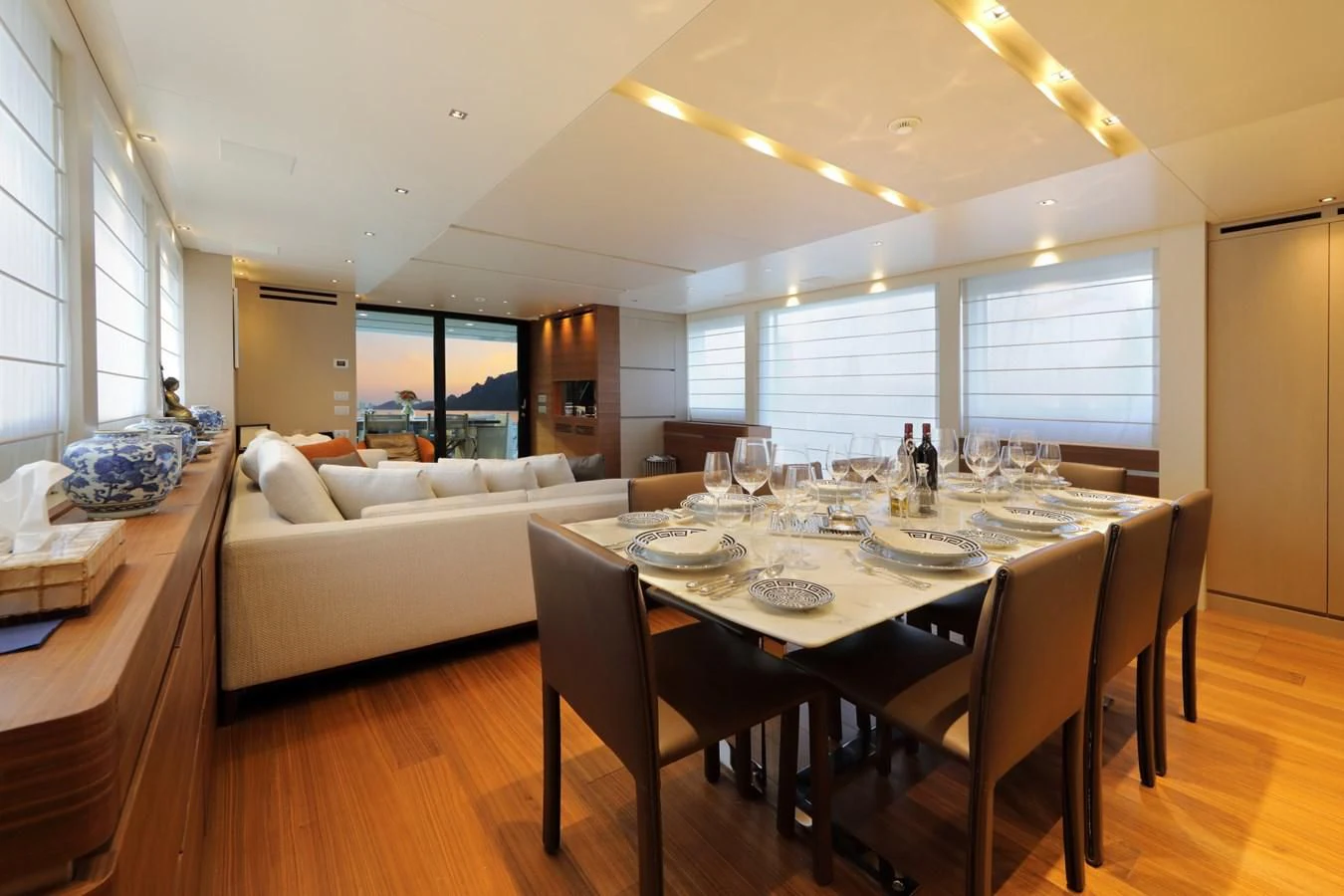 a dining room with a large table aboard COBANA Yacht for Sale