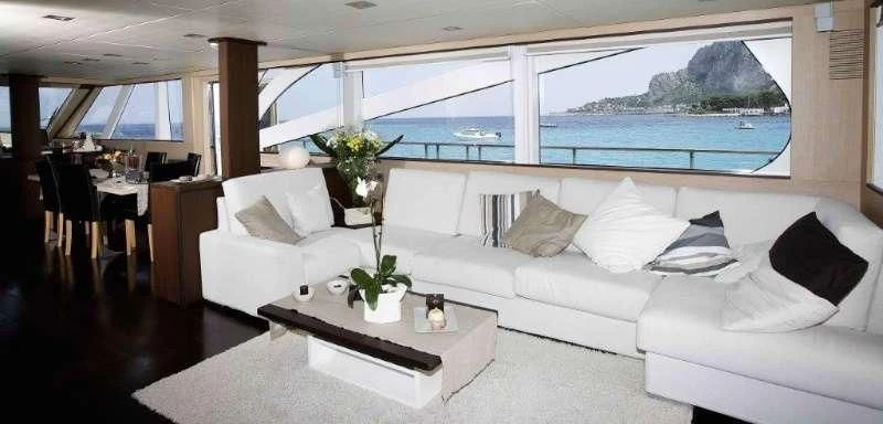 a living room with a large window aboard ARIA Yacht for Sale