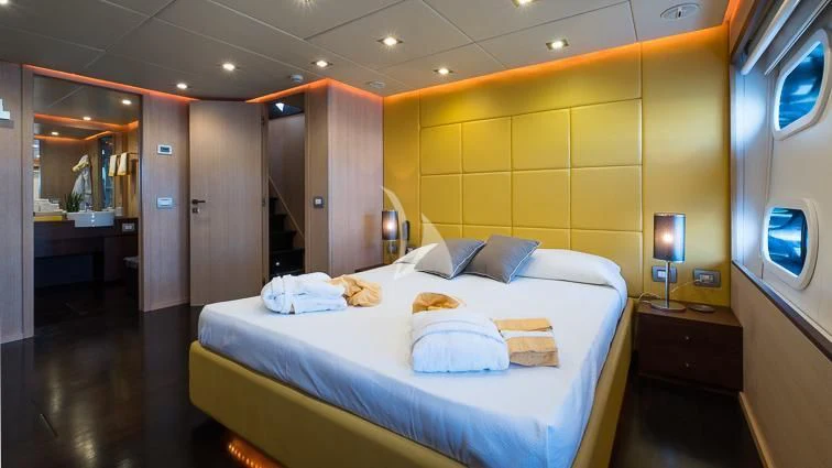 a hotel room with a bed aboard ARIA Yacht for Sale