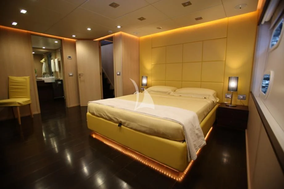 a hotel room with a couple of beds aboard ARIA Yacht for Sale