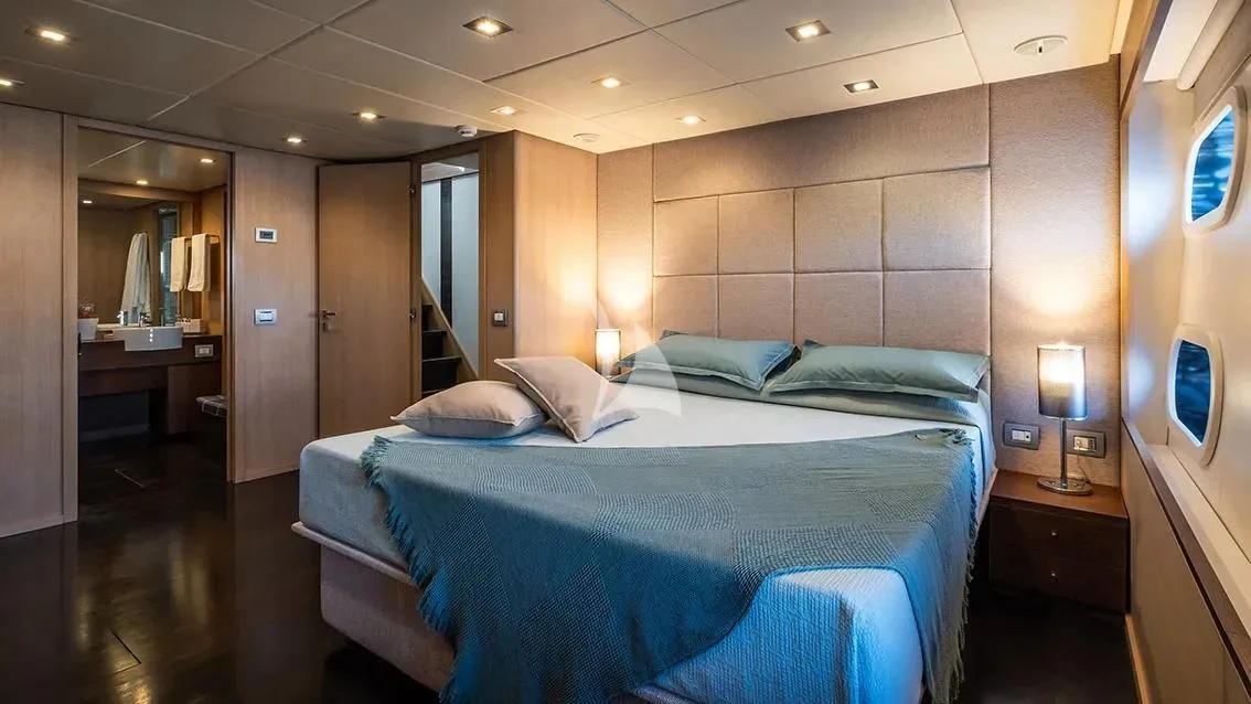 a hotel room with a bed aboard ARIA Yacht for Sale