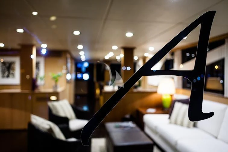 a room with a bed and a piano aboard ARIA Yacht for Sale