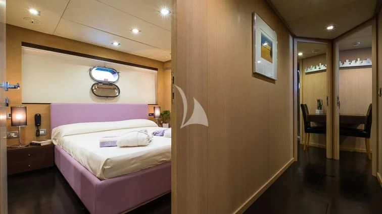 a hotel room with a bed aboard ARIA Yacht for Sale