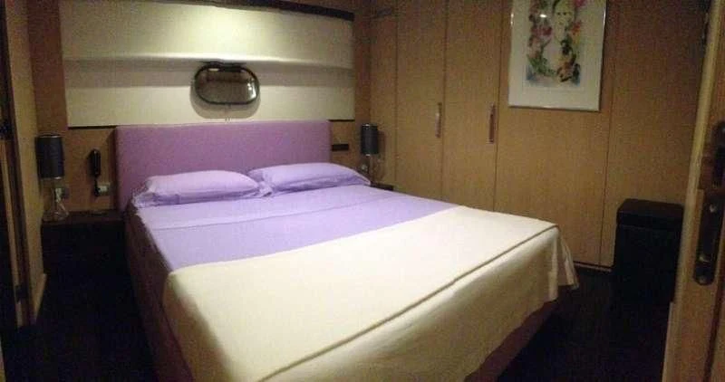 a bed in a room aboard ARIA Yacht for Sale