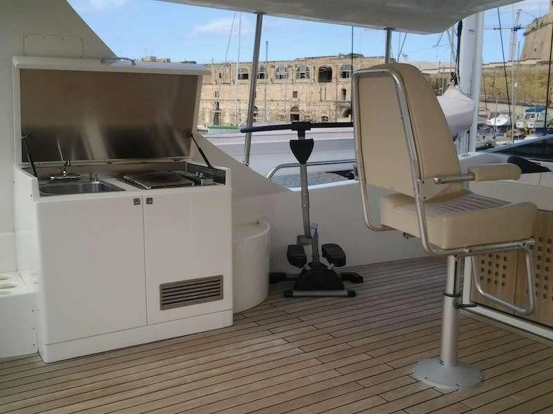 a room with a table and chairs aboard ARIA Yacht for Sale