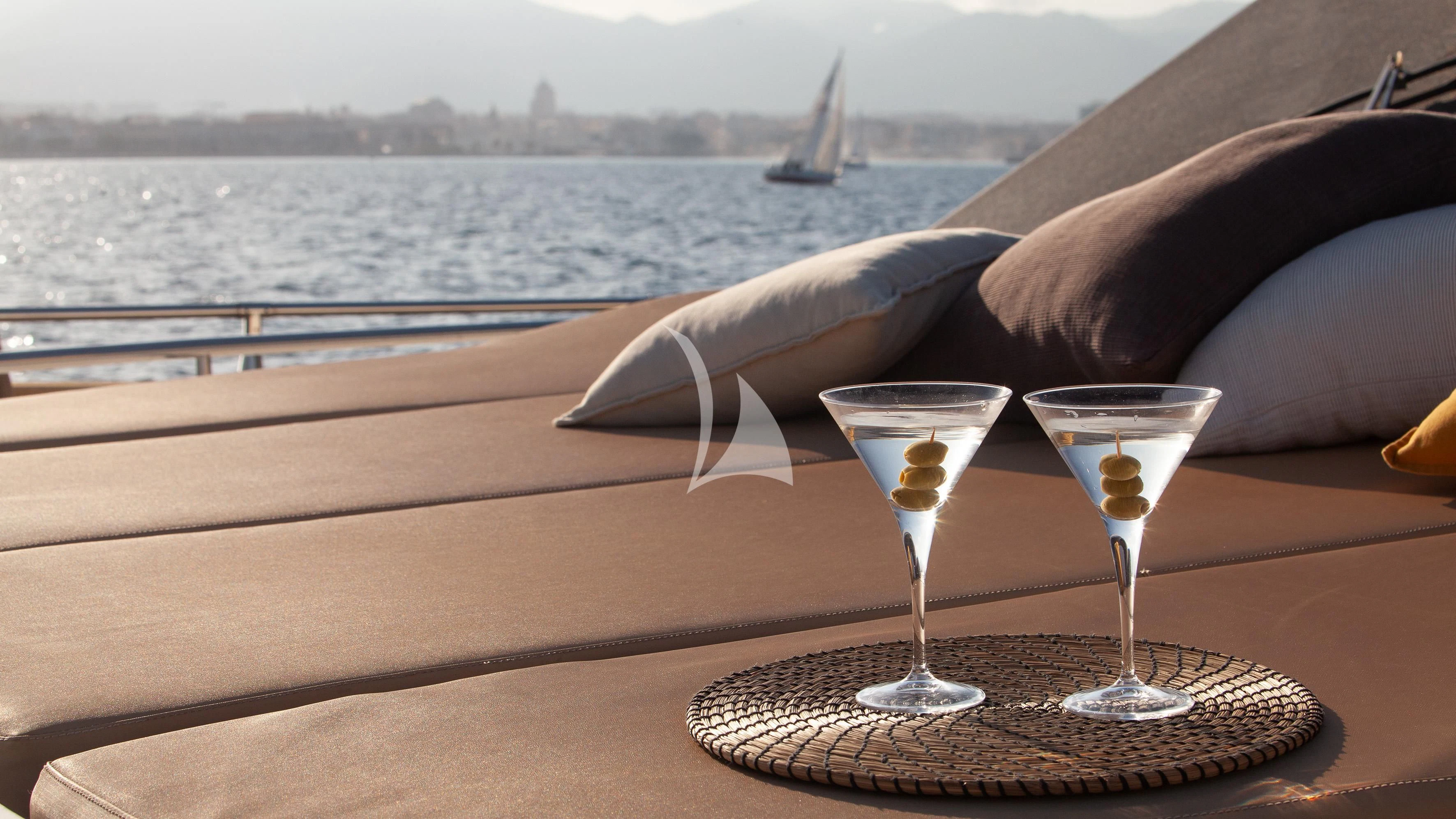 a glass of wine on a table aboard ARIA Yacht for Sale