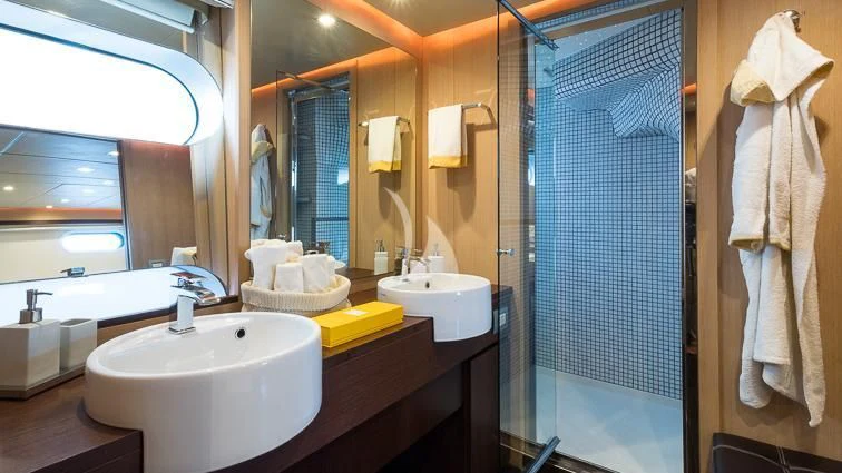 a bathroom with a sink and a shower aboard ARIA Yacht for Sale