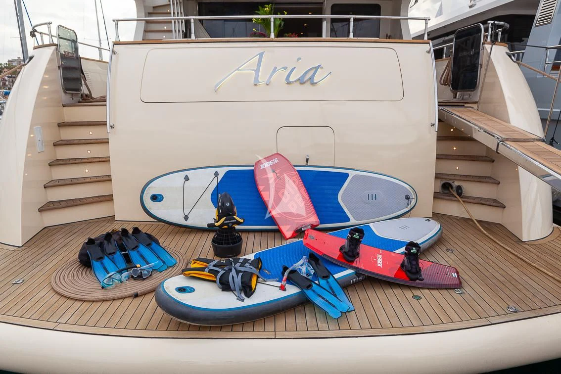 a group of surfboards on a deck aboard ARIA Yacht for Sale