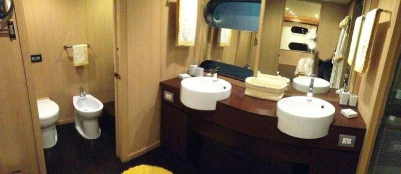 a bathroom with a sink and a toilet aboard ARIA Yacht for Sale