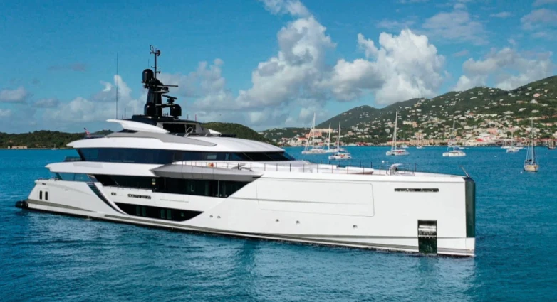 a white yacht in the water aboard COMFORTABLY NUMB Yacht for Sale