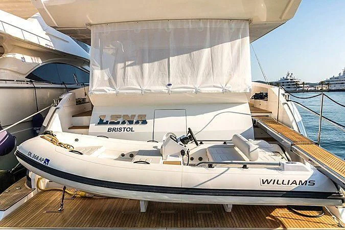 a white yacht on a dock aboard LENA Yacht for Sale