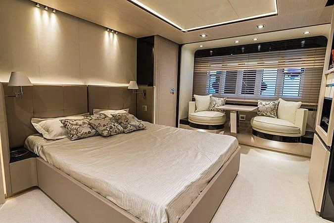 a large bedroom with a large bed aboard LENA Yacht for Sale