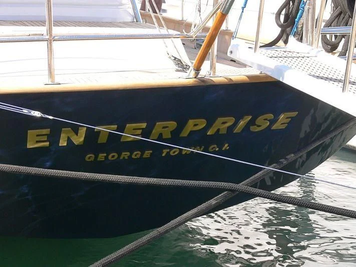 a boat with yellow text aboard ENTERPRISE C Yacht for Sale