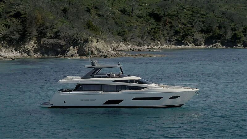 a white yacht in the water aboard EPIC Yacht for Sale