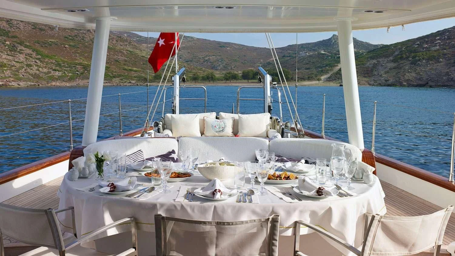 a table set for a dinner on a boat aboard G GIRL Yacht for Sale