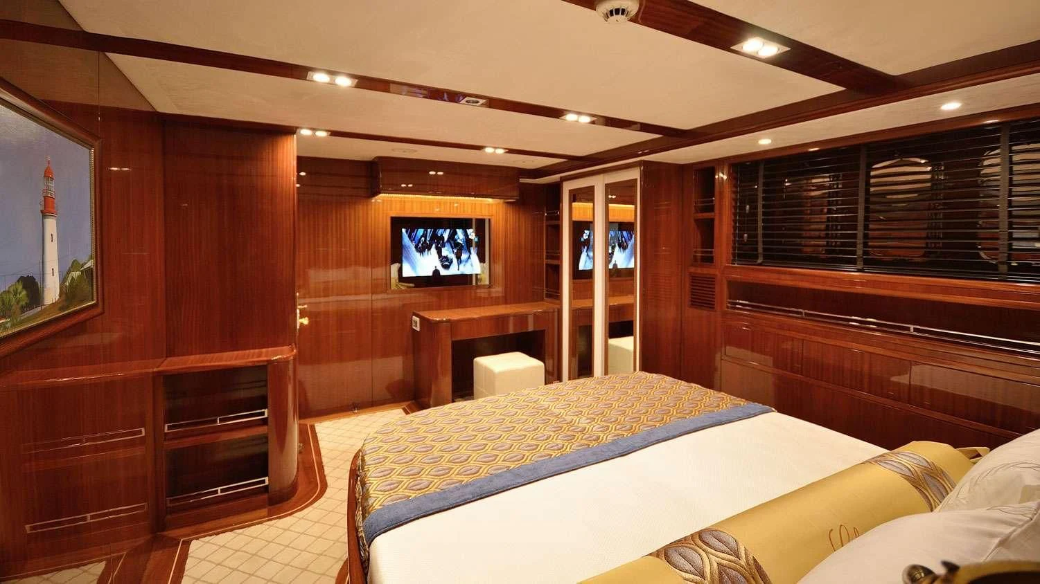 a room with a bed and a tv aboard G GIRL Yacht for Sale