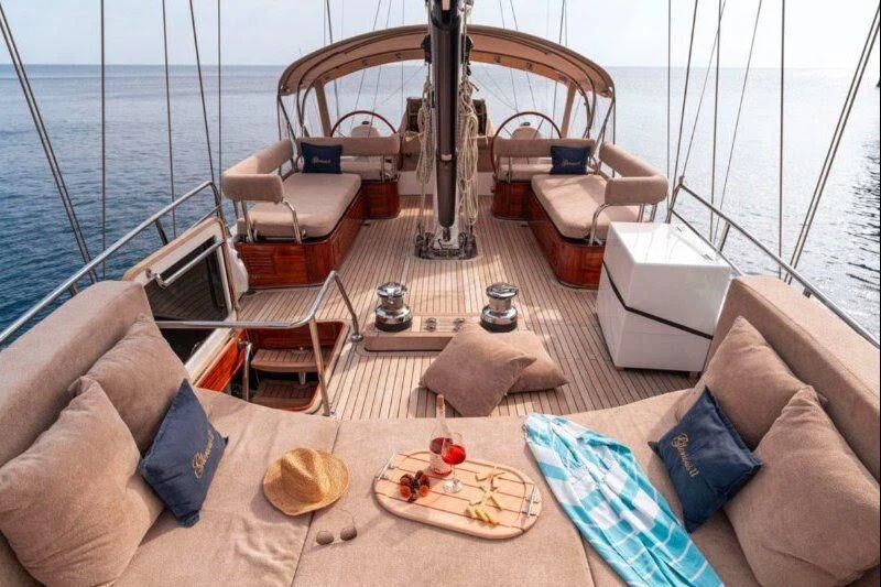 a living room with a large balcony aboard G GIRL Yacht for Sale