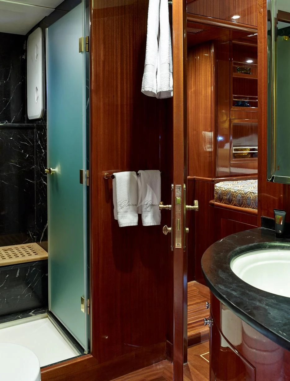 a bathroom with a sink and a mirror aboard G GIRL Yacht for Sale