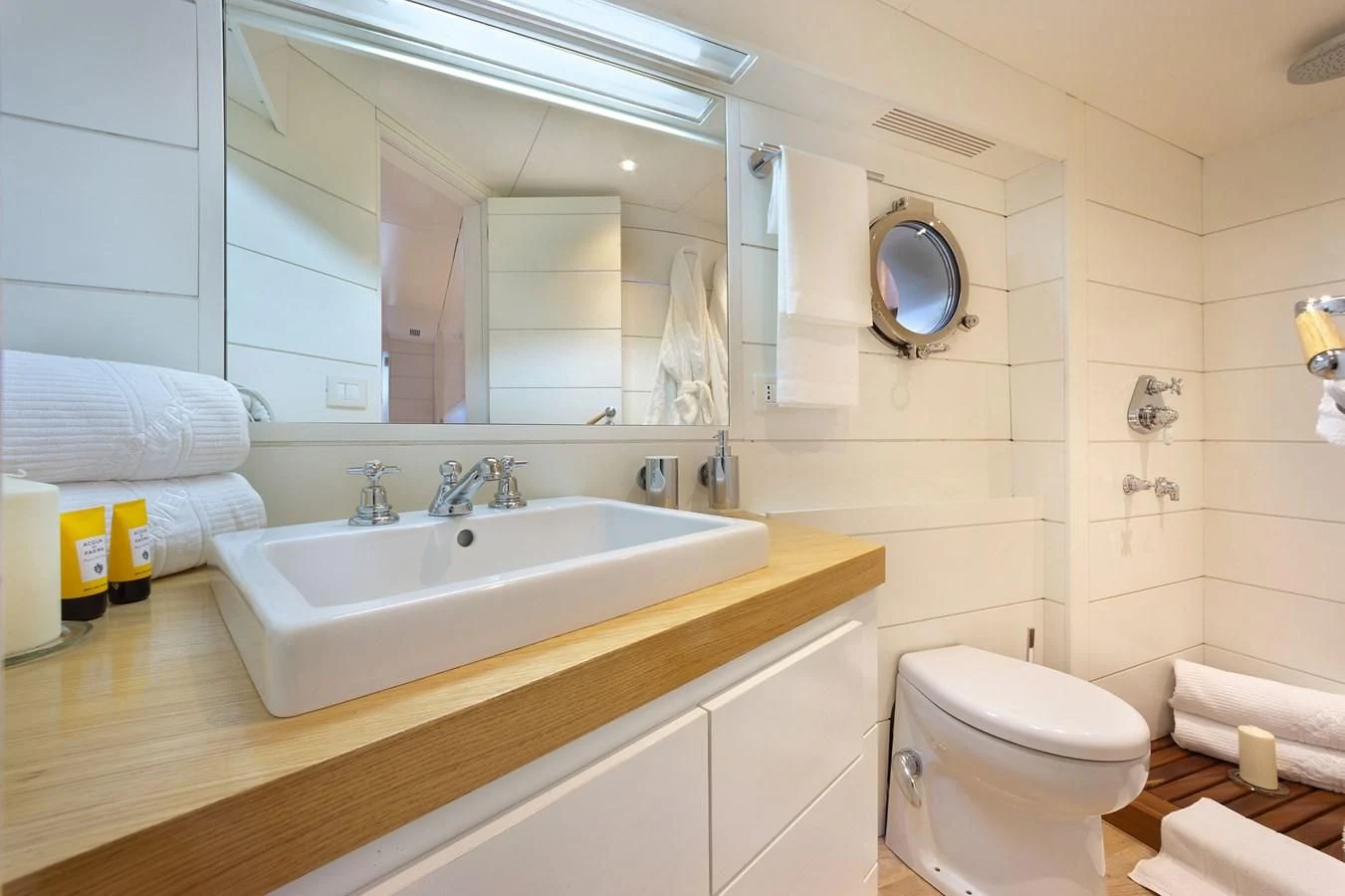 a bathroom with a large mirror aboard VERVECE Yacht for Charter